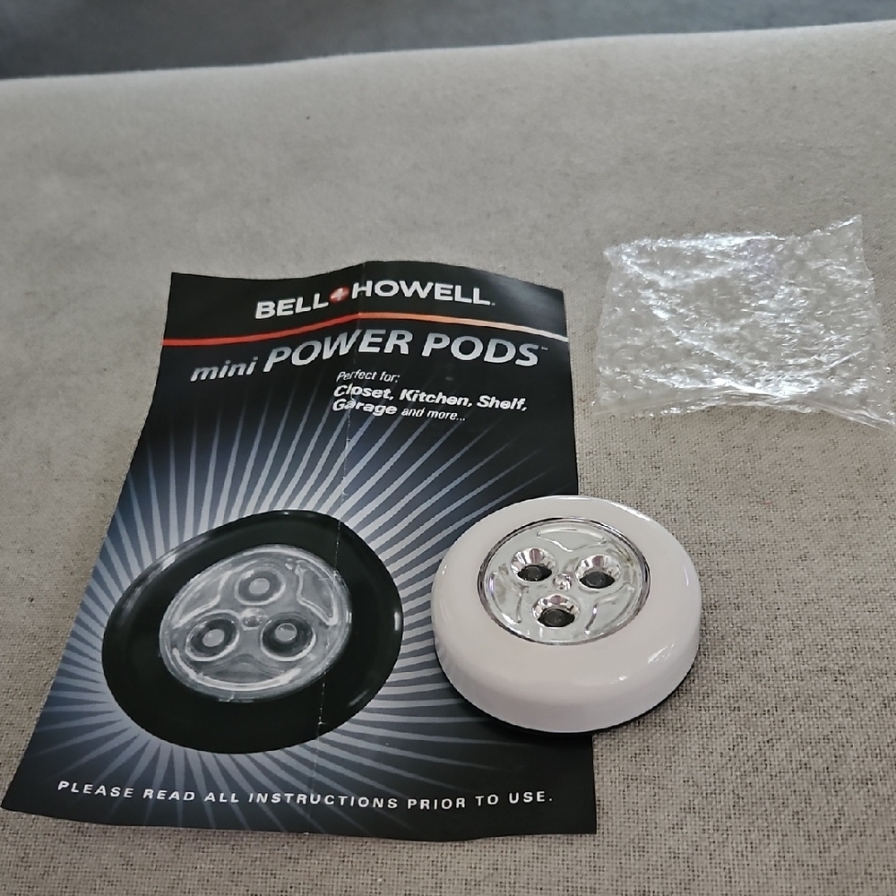 Set of 9 White Mini Power Pod LED Tap Lights.